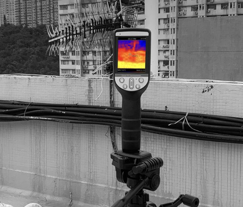 PerfectPrime thermal camera on a stand facing buildings