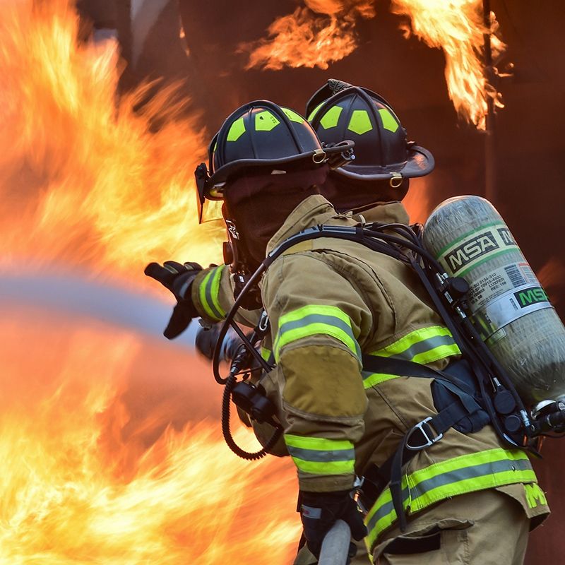 two firefighters fighting fire